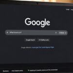 Google homepage with new AI search box and AI Mode button