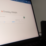 Claude Pro interface showing session windows on a laptop screen with a productivity workspace