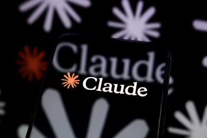 Smartphone displaying the Claude app logo with the orange Anthropic starburst icon on a black background