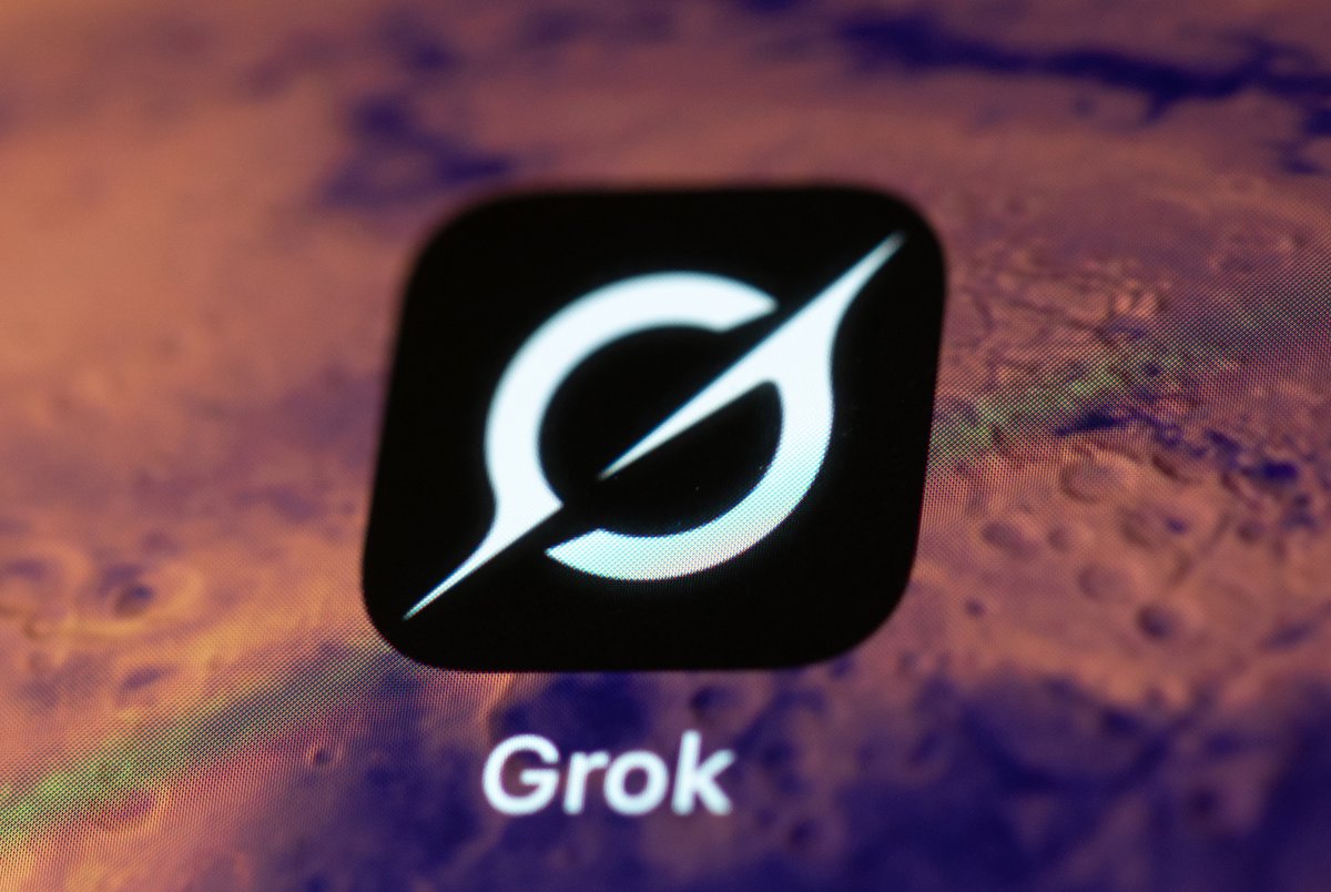 Grok app icon with white logo on a planetary-themed screen background