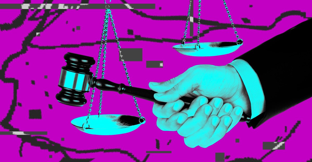 Courtroom gavel beside scattered legal documents
