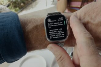 Apple Watch on a wrist showing the Live Rewind transcript screen