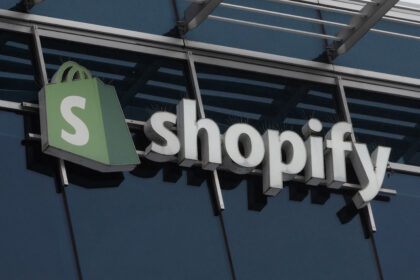 online shopper paying on a laptop with a digital shopping cart interface