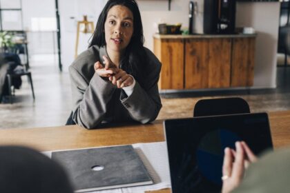 Job candidate negotiating salary in an interview, reflecting the AI skills pay premium