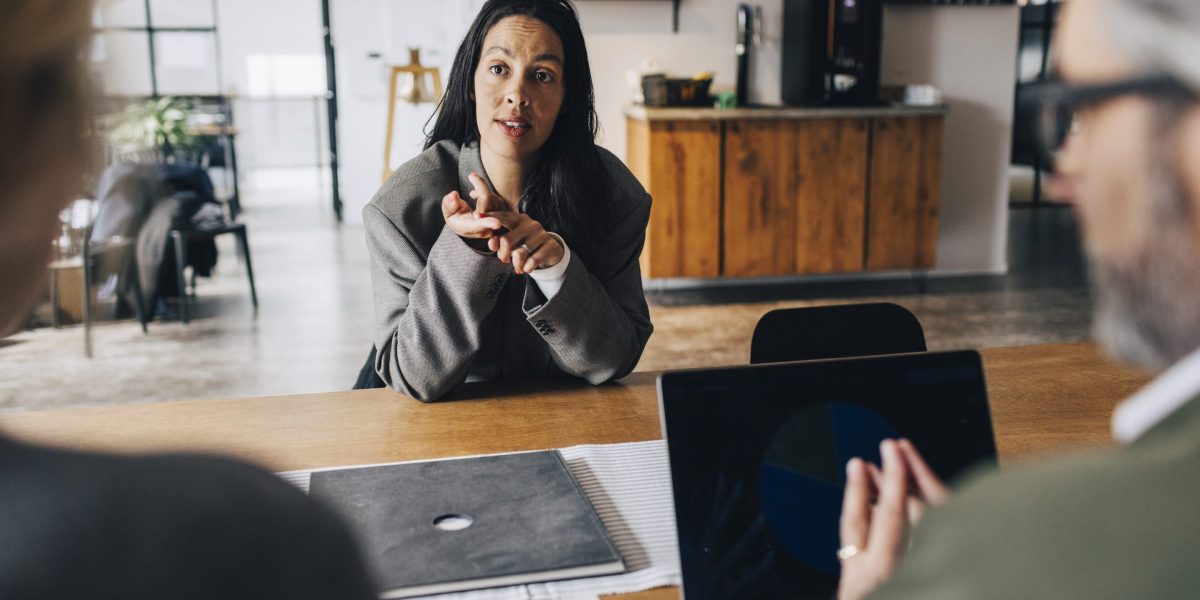 Job candidate negotiating salary in an interview, reflecting the AI skills pay premium