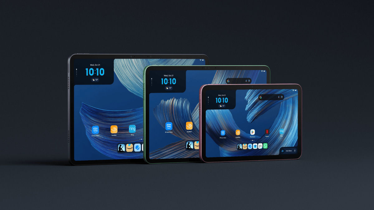 Three Amazon tablets lined up on a dark background