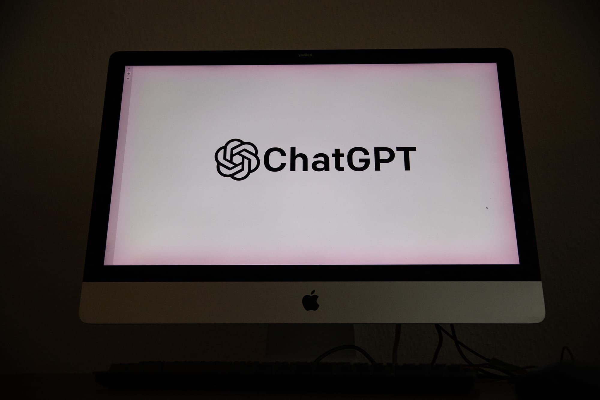 OpenAI and ChatGPT branding shown on a screen