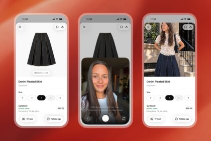 Person using a phone shopping app while comparing outfits on a clothing rack