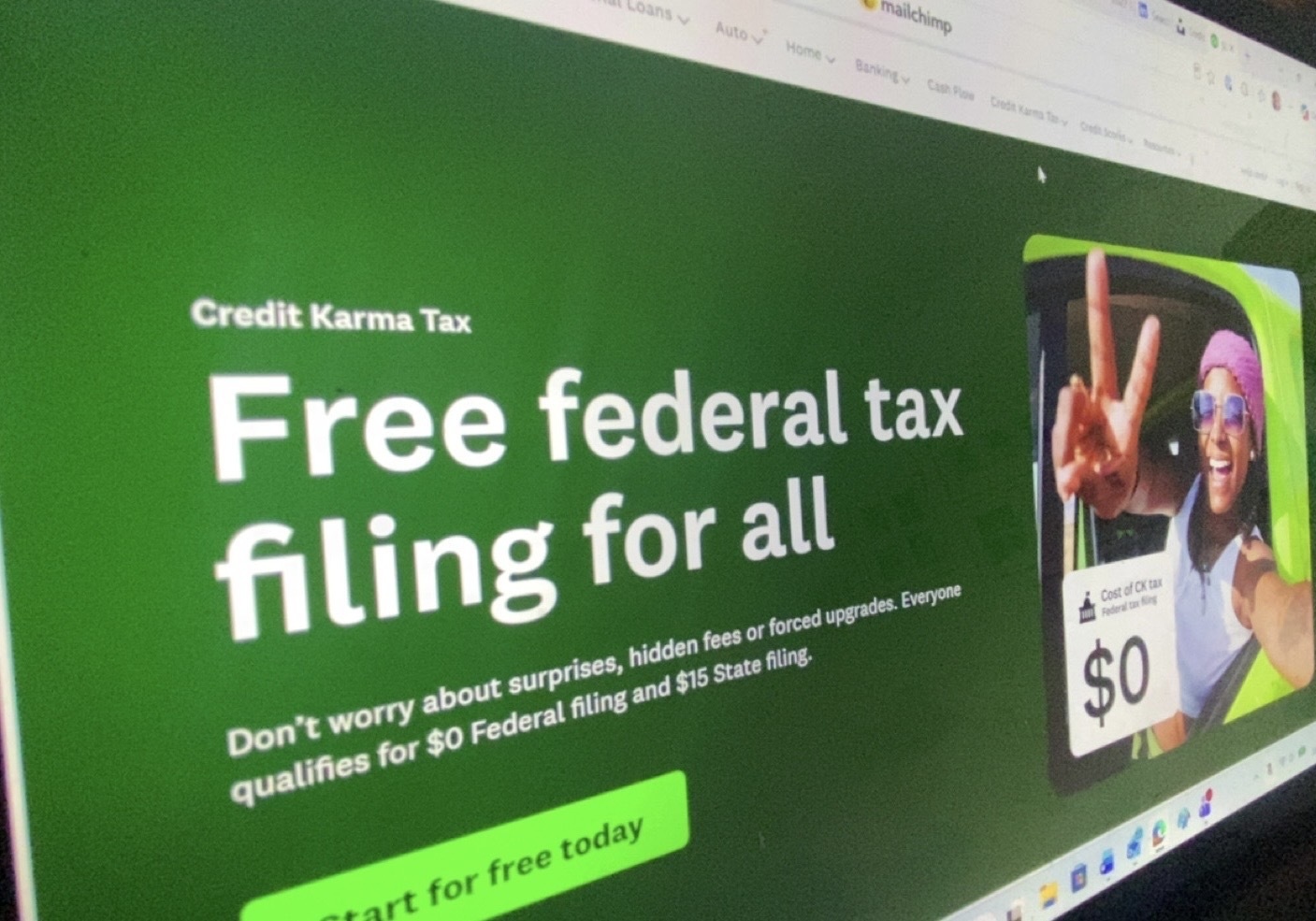 Person preparing tax documents on a laptop at home