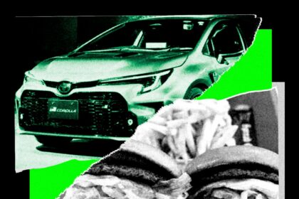 Engineers running an AI driving experiment with a laptop inside a Toyota Corolla