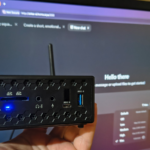 Old mini PC running a small language model through a browser chat window on a home network