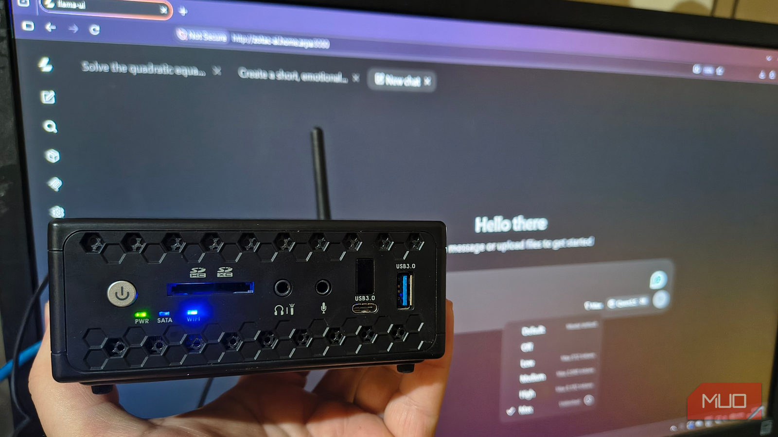 Old mini PC running a small language model through a browser chat window on a home network