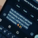 Person dictating a text message on an Android phone with the keyboard open
