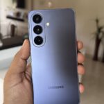 Hand holding a Samsung Galaxy S26 phone showing its notification panel