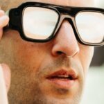 Person wearing the black Snap Specs AR glasses with thick frames